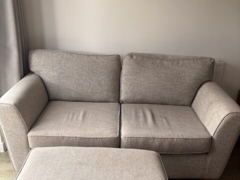 Two seater sofa with footstool