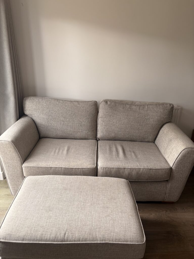 Two seater sofa with footstool