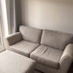 Two seater sofa with footstool