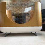 Beautiful Ubabub Pod Cot 2-1 convertible Bed with Junior Bed Conversion Kit in natural wood.
